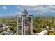 High-rise building with clear glass facade near wooded area and parking lot at 2828 Peachtree Nw Rd # 3100, Atlanta, GA 30305