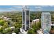 Aerial view of luxury high-rise building surrounded by green spaces at 2828 Peachtree Nw Rd # 3100, Atlanta, GA 30305