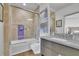 Bathroom with marble countertops, a shower-tub combo, and stylish fixtures at 2828 Peachtree Nw Rd # 3100, Atlanta, GA 30305