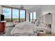 Bright bedroom featuring large windows with scenic views and a neutral color palette at 2828 Peachtree Nw Rd # 3100, Atlanta, GA 30305