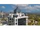 A high-rise building with a unique crown is showcased against a backdrop of a vibrant cityscape at 2828 Peachtree Nw Rd # 3100, Atlanta, GA 30305