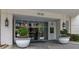 Elegant building entrance featuring large planters and modern lighting fixtures at 2828 Peachtree Nw Rd # 3100, Atlanta, GA 30305