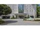 Elegant building entrance with manicured landscaping and a fountain at 2828 Peachtree Nw Rd # 3100, Atlanta, GA 30305