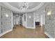 Grand foyer with patterned wallpaper, modern lighting, and steel and glass entry doors at 2828 Peachtree Nw Rd # 3100, Atlanta, GA 30305