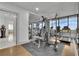 Brightly lit gym featuring modern exercise equipment, mirrored walls, and large windows with scenic views at 2828 Peachtree Nw Rd # 3100, Atlanta, GA 30305