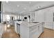 Bright kitchen with a large island, marble countertops, and open layout to the dining and living areas at 2828 Peachtree Nw Rd # 3100, Atlanta, GA 30305
