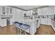 Modern kitchen features white cabinets, marble countertops, stainless steel appliances, and a center island with seating at 2828 Peachtree Nw Rd # 3100, Atlanta, GA 30305