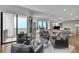 Open concept living area with balcony access, pool table and modern seating at 2828 Peachtree Nw Rd # 3100, Atlanta, GA 30305