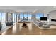 Open concept living area with balcony access, pool table and modern seating at 2828 Peachtree Nw Rd # 3100, Atlanta, GA 30305