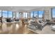 Open concept living area with balcony access, pool table and modern seating at 2828 Peachtree Nw Rd # 3100, Atlanta, GA 30305
