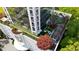 Aerial view showcasing a rooftop garden with lush greenery and outdoor seating areas at 2828 Peachtree Nw Rd # 3100, Atlanta, GA 30305
