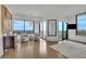Sitting room featuring floor to ceiling windows with city views, modern light fixture, and artistically decorated at 2828 Peachtree Nw Rd # 3100, Atlanta, GA 30305