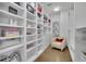 Walk-in closet featuring custom built-in shelving, storage drawers, and room for accessories at 2828 Peachtree Nw Rd # 3100, Atlanta, GA 30305