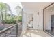 Outdoor balcony view with a metal fence and an open door leading to a bedroom at 379 Pratt Se Dr # 408, Atlanta, GA 30315