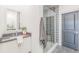 Bathroom with a sleek vanity, modern mirror, and a glass-enclosed shower at 379 Pratt Se Dr # 408, Atlanta, GA 30315