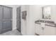 Bathroom vanity area with gray countertops, white cabinets, and modern fixtures at 379 Pratt Se Dr # 408, Atlanta, GA 30315