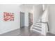 Stylish entryway with a gray accent door, hardwood floors, and modern staircase leading to the upper level at 379 Pratt Se Dr # 408, Atlanta, GA 30315