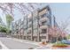 Beautiful modern townhome complex with attached garages on a tree-lined street with sidewalks at 379 Pratt Se Dr # 408, Atlanta, GA 30315