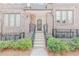 Townhome entrance with brick facade, stairs, and neatly trimmed greenery at 379 Pratt Se Dr # 408, Atlanta, GA 30315