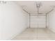 Clean and empty garage with a white door, and concrete flooring, providing ample space for parking at 379 Pratt Se Dr # 408, Atlanta, GA 30315