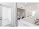 Hallway with laundry area featuring a new washer and dryer, built-in shelves, and access to additional rooms at 379 Pratt Se Dr # 408, Atlanta, GA 30315