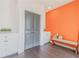 Hallway with built-in storage, accent wall, and hardwood floors at 379 Pratt Se Dr # 408, Atlanta, GA 30315