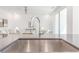 Close-up of a modern kitchen sink with a view to the living room at 379 Pratt Se Dr # 408, Atlanta, GA 30315