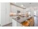 Well-lit kitchen with white cabinetry, stainless steel appliances, and a spacious island at 379 Pratt Se Dr # 408, Atlanta, GA 30315