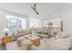 Living room with view of modern kitchen, dining table, and access to the patio at 379 Pratt Se Dr # 408, Atlanta, GA 30315