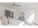 Bright bedroom with ceiling fan, access to a walk-in closet, and modern decor elements at 379 Pratt Se Dr # 408, Atlanta, GA 30315