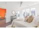 Bright main bedroom featuring a ceiling fan, large windows, decor and access to a private balcony at 379 Pratt Se Dr # 408, Atlanta, GA 30315