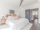 Inviting main bedroom featuring hardwood flooring, modern ceiling fan, large windows, and a comfortable king-size bed at 379 Pratt Se Dr # 408, Atlanta, GA 30315