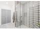 Modern tiled shower with glass enclosure and built-in bench seating at 379 Pratt Se Dr # 408, Atlanta, GA 30315