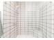 Shower with a gray-and-white tiled walls and glass enclosure at 379 Pratt Se Dr # 408, Atlanta, GA 30315