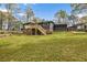 Expansive backyard featuring a deck, lush lawn, and storage shed at 1185 Winterberry Ct, Lawrenceville, GA 30043