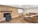Finished basement with a brick fireplace, a screen and a comfortable seating area, perfect for entertaining at 1185 Winterberry Ct, Lawrenceville, GA 30043
