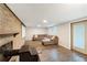 Finished basement with a brick fireplace, a screen and a comfortable seating area, perfect for entertaining at 1185 Winterberry Ct, Lawrenceville, GA 30043