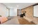 Finished basement featuring a brick fireplace, projection screen, and cozy seating, ideal for relaxation at 1185 Winterberry Ct, Lawrenceville, GA 30043