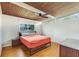 Cozy bedroom featuring hardwood floors, ceiling fan, and natural light at 1185 Winterberry Ct, Lawrenceville, GA 30043
