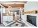Bright kitchen with white cabinets, stainless steel appliances, and a decorative fireplace at 1185 Winterberry Ct, Lawrenceville, GA 30043