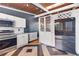 Stylish kitchen with stainless steel appliances, custom cabinets, granite counters, and decorative tile flooring at 1185 Winterberry Ct, Lawrenceville, GA 30043