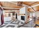 Stunning kitchen with a unique tiled floor, white cabinetry, and a cozy fireplace at 1185 Winterberry Ct, Lawrenceville, GA 30043