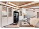 Modern living room with custom cabinets, unique wood ceiling, and decorative fireplace with a granite countertop at 1185 Winterberry Ct, Lawrenceville, GA 30043