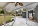 Relaxing covered patio area with comfortable seating and a view of the yard at 1185 Winterberry Ct, Lawrenceville, GA 30043