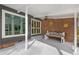 Charming covered porch with a welcoming bench, plants, and decorative touches at 1185 Winterberry Ct, Lawrenceville, GA 30043