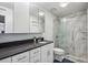 Modern bathroom with marble shower, updated cabinets, and elegant fixtures at 1255 Branch Dr, Tucker, GA 30084