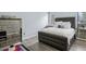 This bedroom features wood floors and a luxuriously padded headboard at 1255 Branch Dr, Tucker, GA 30084