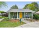 Charming clubhouse exterior with benches, columns, and landscaping, offering a welcoming community space at 1255 Branch Dr, Tucker, GA 30084