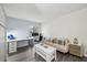Open living space with large desk, couch, and contemporary furnishings at 1255 Branch Dr, Tucker, GA 30084