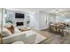 Spacious living area featuring a fireplace, a modern TV, and views into the dining area with abundant light at 1255 Branch Dr, Tucker, GA 30084